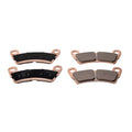 Set of four copper-framed rear brake pads with black and gray friction surfaces for Polaris UTV.