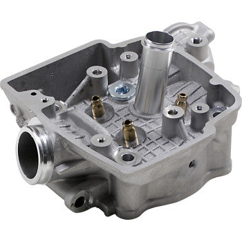Silver metal Honda cylinder head with multiple bolt holes and tubular ports, designed for offroad engine fitment.
