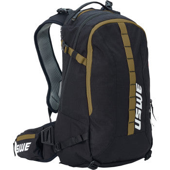 The Core Off Road Daypack 16L Black Bronze by Uswe features bronze accents, white USWE branding on the side and waist strap, multiple compartments, and padded shoulder straps for comfort on any ride.