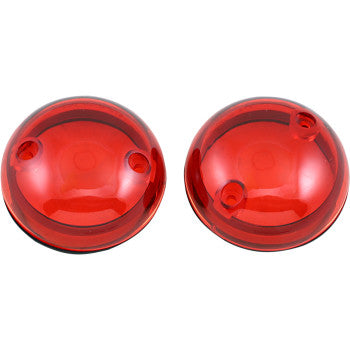 Two round, red ProBEAM® Lens by Custom Dynamics with two small holes each are placed side by side on a white background.