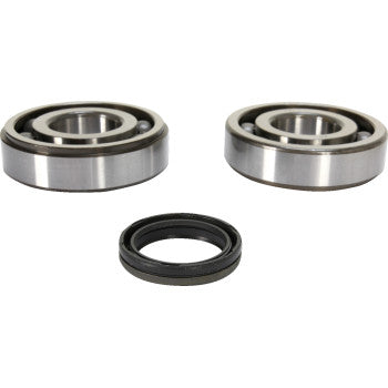 The Yamaha Crank Bearing and Seal Kit by Prox includes two metal ball bearings and one black rubber crankshaft seal, shown on a white background in a triangular layout with the seal positioned below the two bearings.