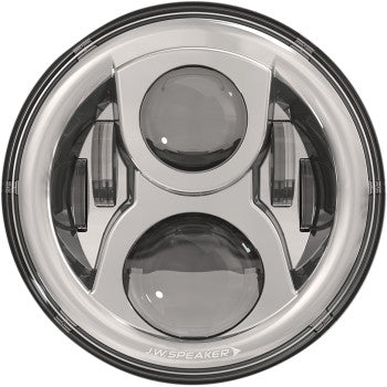 The Headlight with Mounting Ring - Chrome by J.W. Speaker features a round design with two large circular lenses, silver and black housing, geometric accents, and advanced Dual-Burn technology for improved visibility.