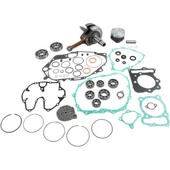 Complete engine rebuild kit featuring metal crankshaft, multiple circular bearings, various black and green gaskets, piston.