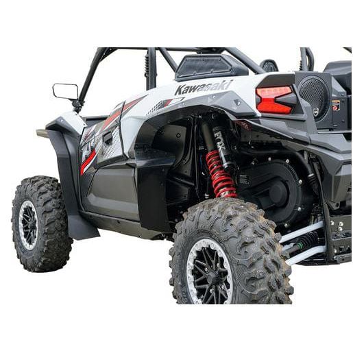 A close-up of the rear and side of a Kawasaki ATV fitted with Kawasaki Krx 1000 4 Fender Flares (Set of 4) by Spike, highlighting rugged tires, red coil suspension, and black HMW haircell polyethylene with bold black and red accents.