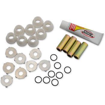 Set of white plastic bushings, metal cylindrical sleeves, black O-rings, and a tube of lubricant arranged on a white.