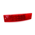 Rectangular red taillight lens with multiple round LED sections and textured edges.