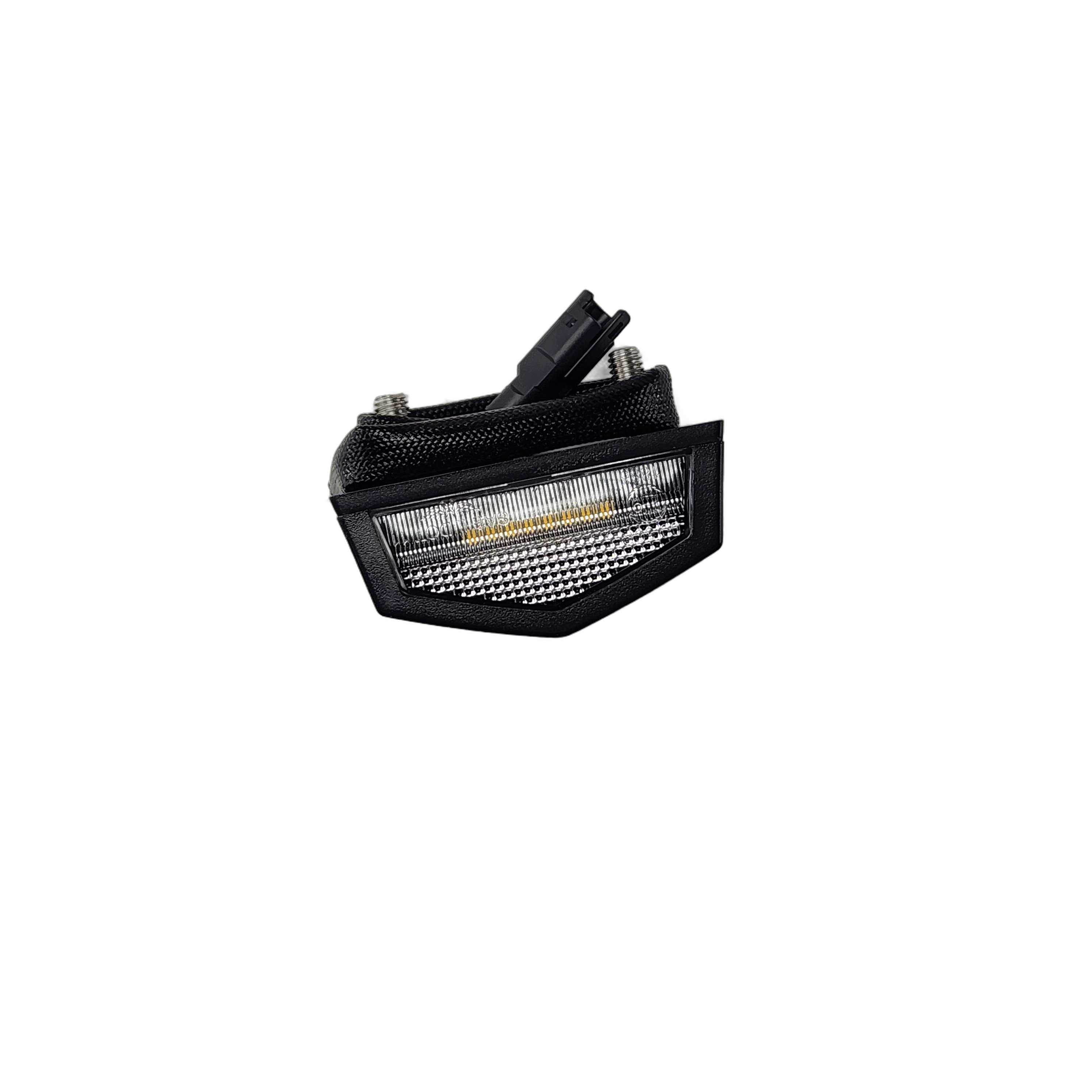 A black and silver Lamp by Polaris LED tail light with a clear cover and visible mounting screws, photographed on a white background. Quality OEM Victory Polaris part from Witchdoctors.