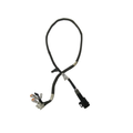 Black electrical tail light harness with multiple wire connectors and protective sleeve.