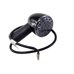 The Asm-Tsgnl Led Rr Stt Ece RH Black by Polaris is an OEM black motorcycle turn signal with a clear, textured lens and connector—ideal for those seeking genuine Indian motorcycle parts.