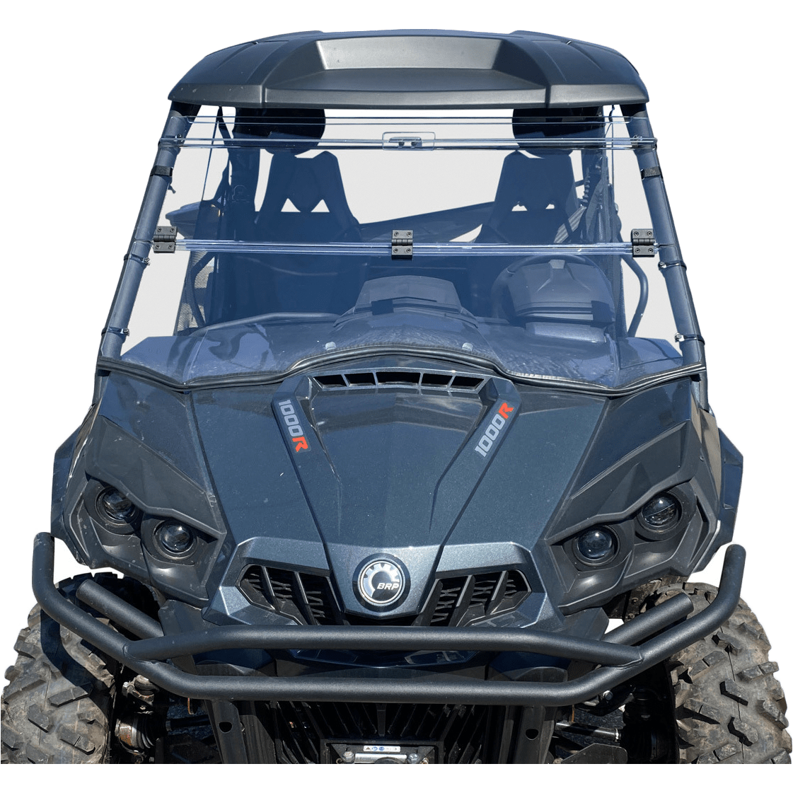 A front view shows a sturdy off-road utility vehicle with a Folding Windshield by Open Trail for optimized airflow, large rugged tires, two seats, and 1000R hood markings—perfect for rough terrain.