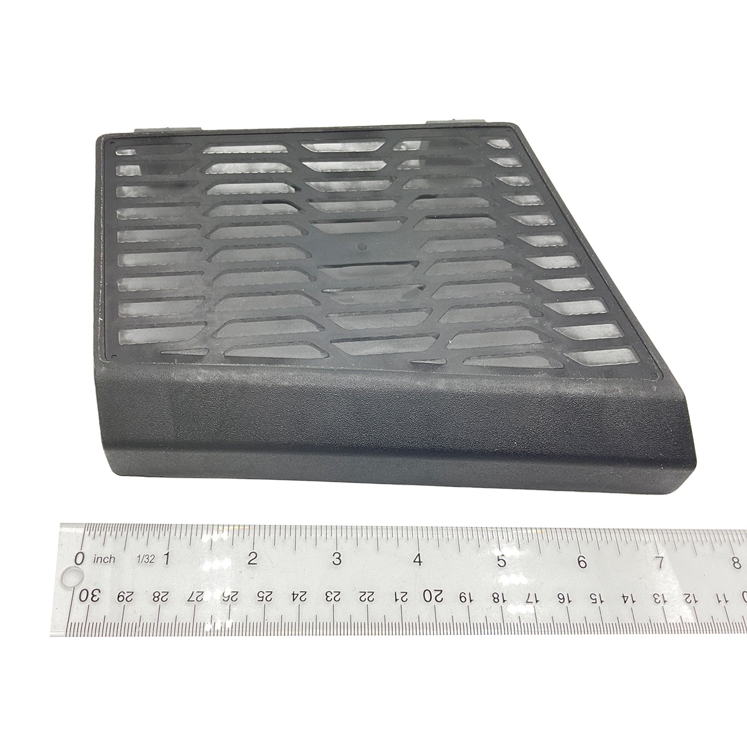 Black plastic rear inner fender with vented design and angled shape for Polaris Ranger, next to ruler.