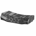 Black molded plastic lower trunk backrest with triangular textured pattern and contoured shape.