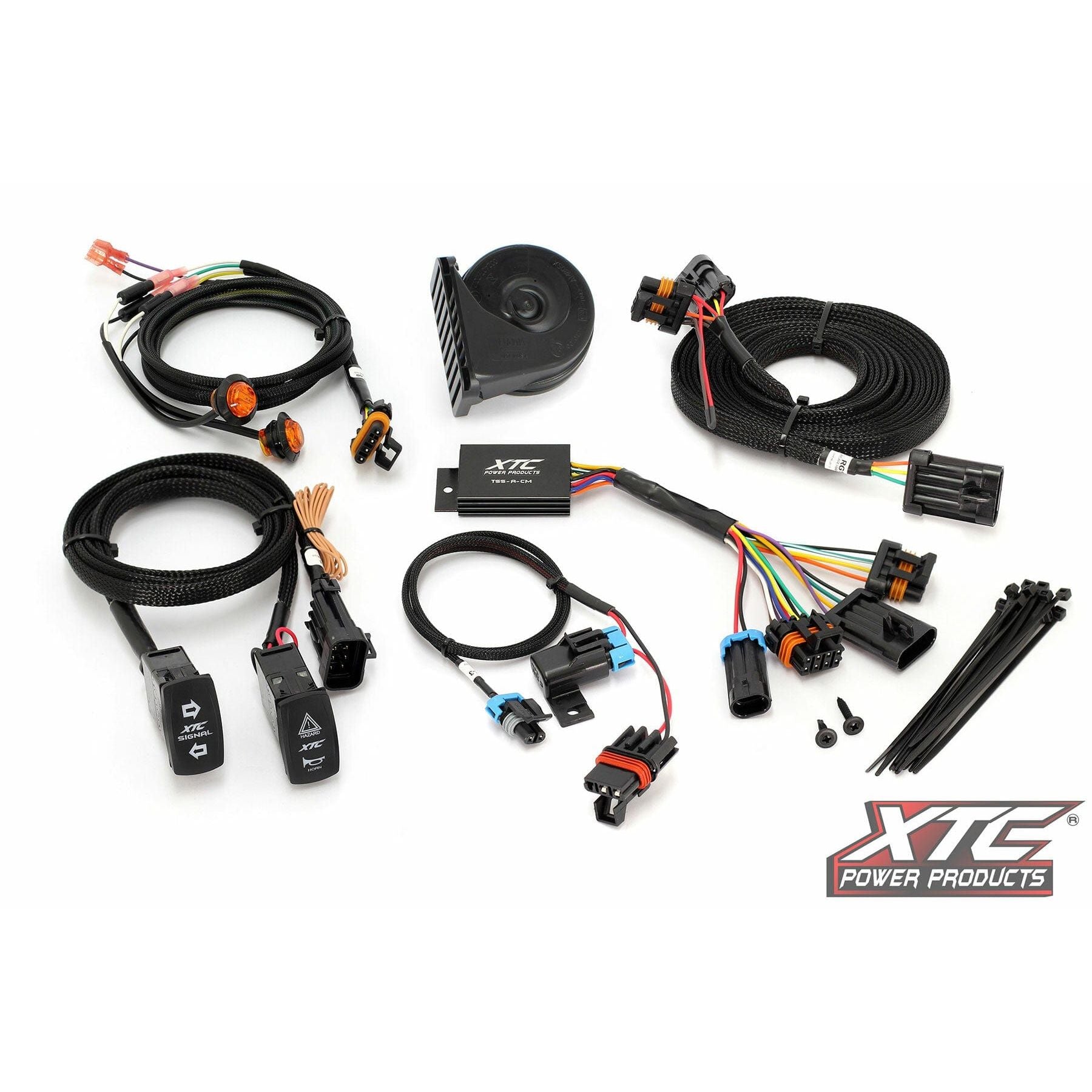 The Self Canceling Turn Signal Kit Pol by XTC Power includes cables, connectors, switches, zip ties, a relay, and an electronic control box in a tidy layout with the XTC Power Products logo in the bottom right corner.