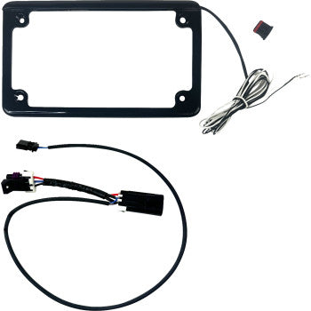 The Can Am Maverick License Plate Frame Gloss Black by Custom Dynamics features an integrated LED plate light with attached wiring, plus a separate harness with connectors, all shown on a white background.