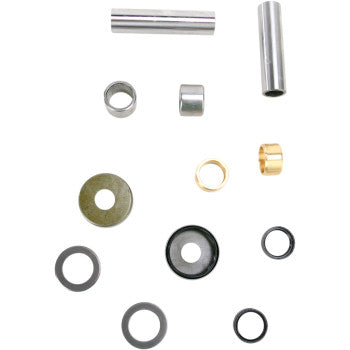 The Swingarm Bearing Kit by Pivot Works includes assorted metal bushings, washers, and sleeves in multiple sizes and finishes—ideal for suspension or linkage kit repairs—engineered to meet OEM specs and arranged neatly on a white background.