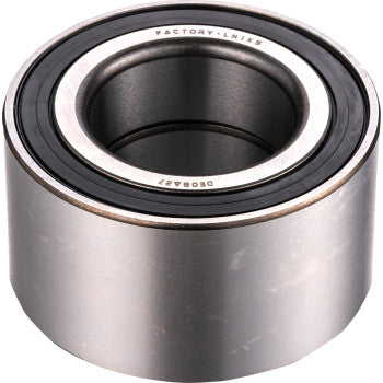 A close-up of the Axle Bearing Kit Front Middle Rear by Factory Links, showing a metal cylindrical bearing with black dust seals and engraved text—perfect for off-road wheel bearing kits.