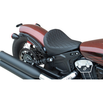 Black diamond-stitched vinyl solo seat mounted on a motorcycle with a brown rear fender and black exhaust system.