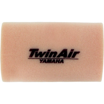 The Yamaha Standard Air Filter by Twin Air is a rectangular light tan foam filter with TwinAir YAMAHA in black, featuring a dual-bonded foam design that boosts airflow and enhances engine protection.