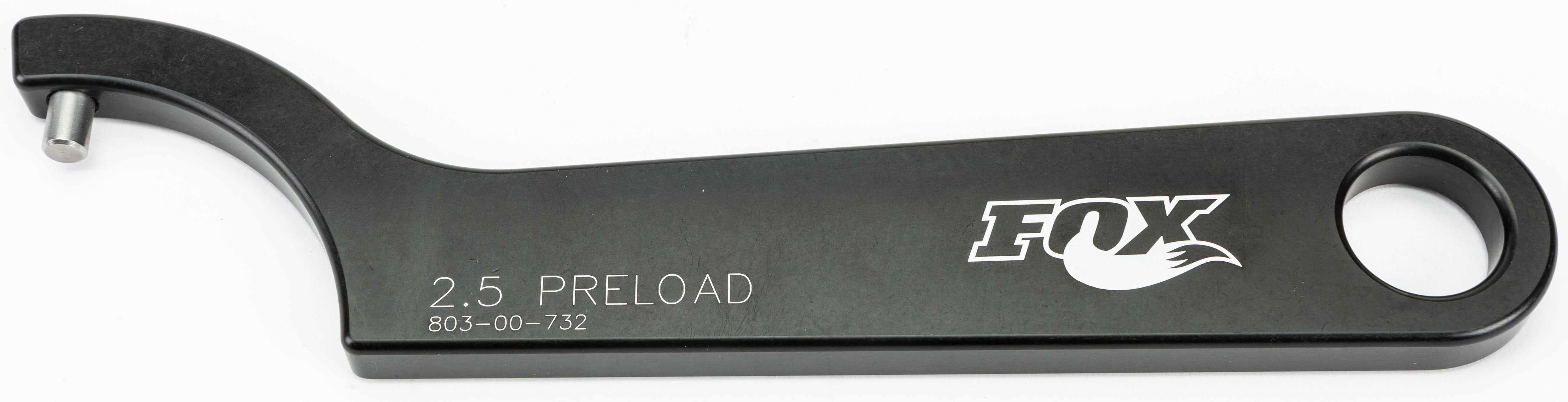 The Spanner Wrench 2.5 Preload by Fox is black, with a circular hole at one end and a hook with a pin at the other. The handle features the FOX logo and 2.5 PRELOAD 803-00-732 printed on it.