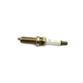 Metal spark plug with white ceramic insulator and threaded body designed for Polaris ATV engines.