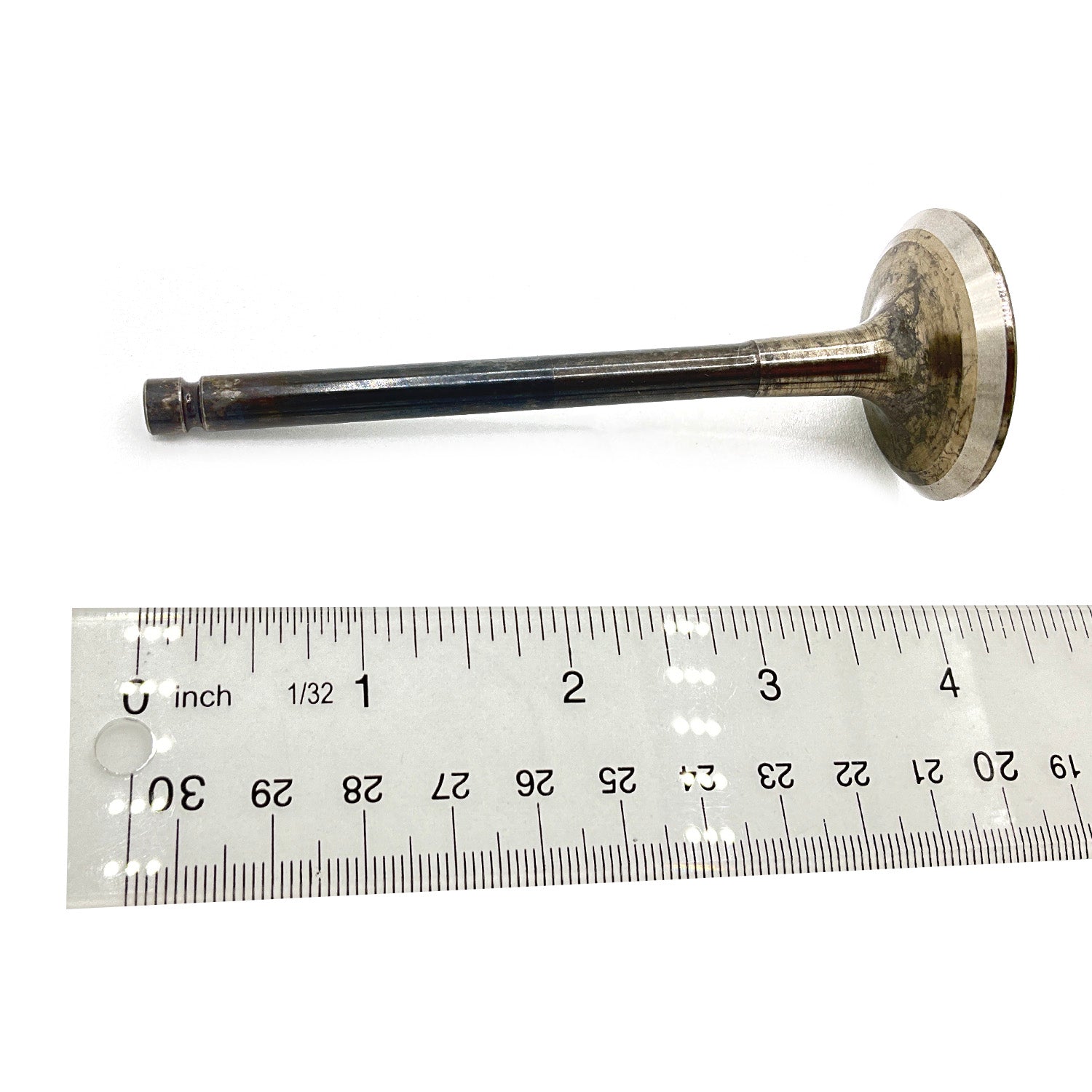 38mm metal exhaust valve with flat circular head and narrow stem next to transparent ruler.