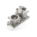 Silver metal thermostat housing with multiple cylindrical openings and mounting points.