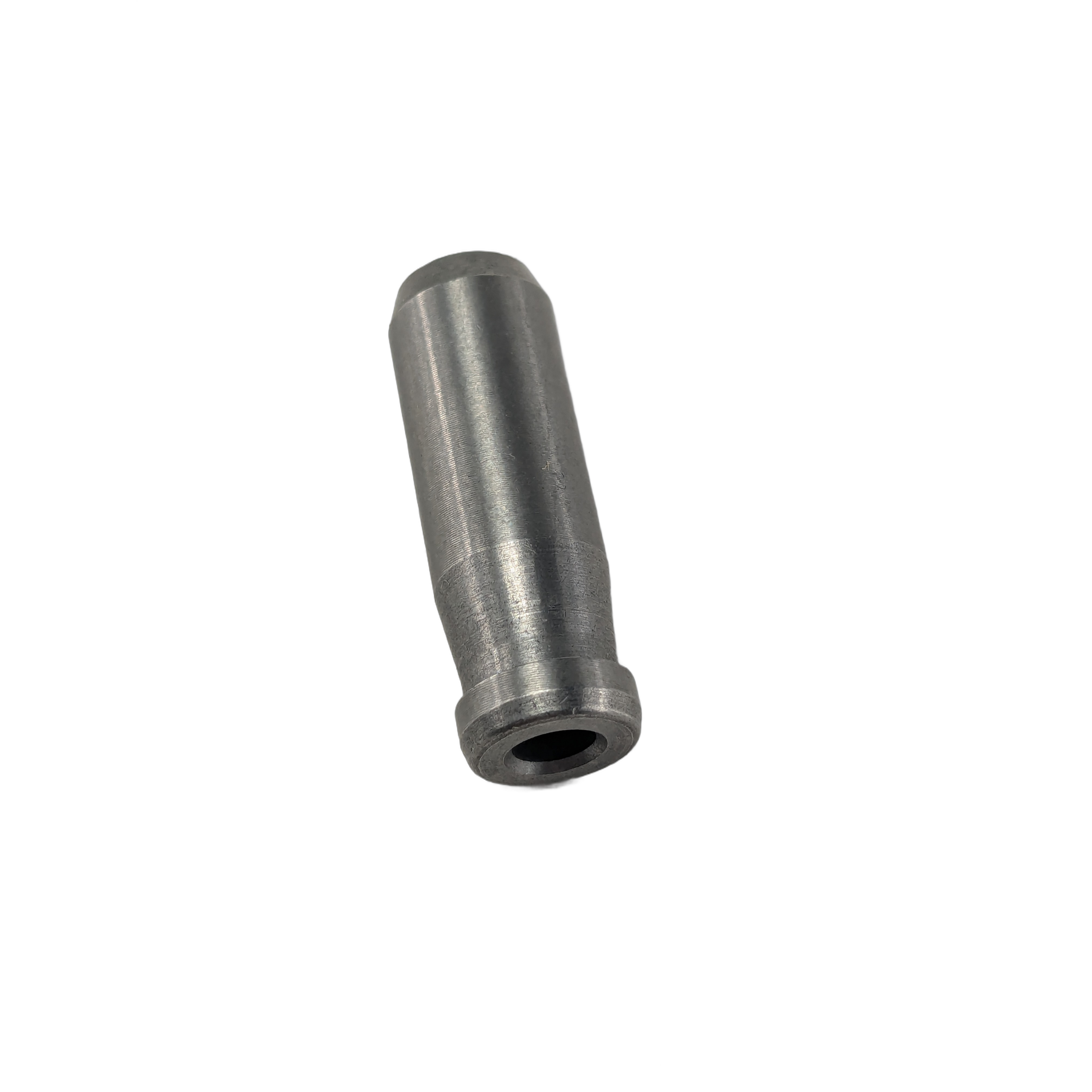 Metallic cylindrical valve guide with a slightly tapered body and hollow center opening.