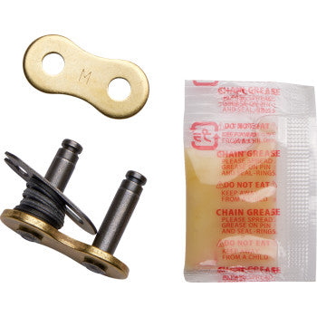 The 525 Max X Connecting Link Clip Gold by Rk includes a gold connecting link plate, O-ring metal master link, and chain grease packet, all displayed on a white background.