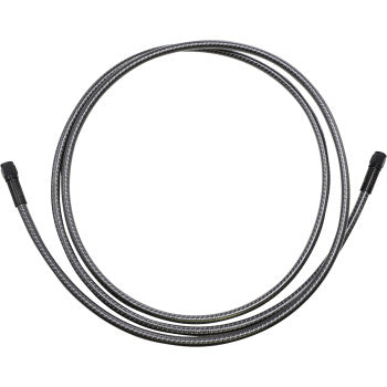 The KARBONFIBR Brake Line 76" by Magnum Shielding is a coiled, flexible metal hose with black connectors and a carbon fiber braid, displayed in a circular shape on a white background.