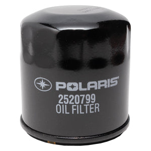 Black cylindrical Polaris oil filter with white logo and part number 2520799 printed on side.