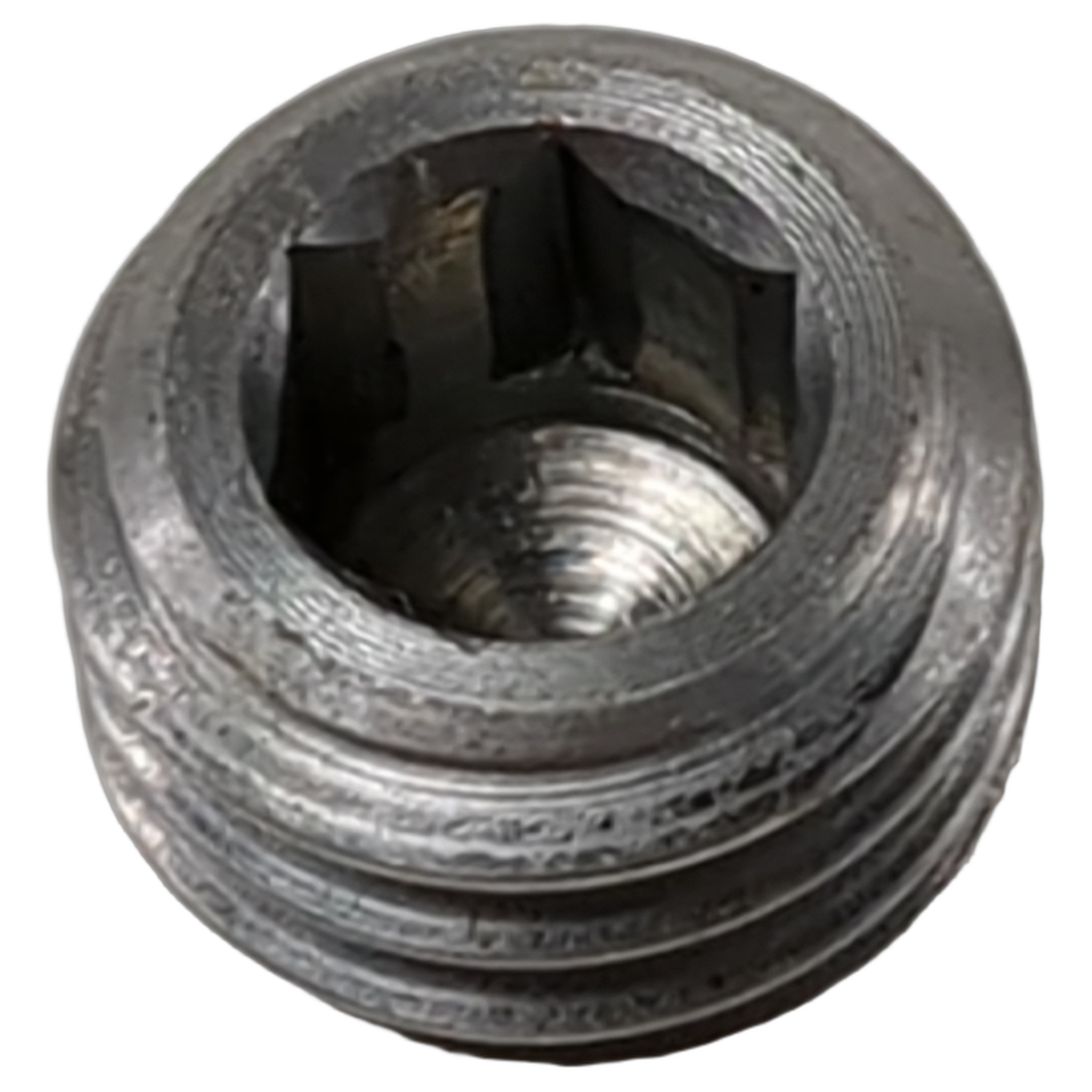 Metallic threaded circular plug with a slotted inner cavity and a slightly textured surface.