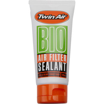 Twin Airs Bio Air Filter Sealant 100ml is a biodegradable sealant for foam air filters, ideal for extreme conditions, and comes in white, orange, and green packaging.