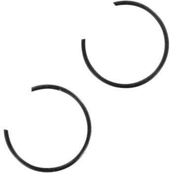 Two black, circular Circlip by Wiseco parts with open ends are positioned diagonally from each other on a white background.