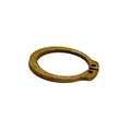 Rust-colored metal retaining ring with a circular shape and two small holes at the open end.