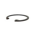 Black metal retaining ring with open-ended circular design and small hole near one end.