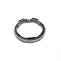 Round metal spring kit with segmented black rubber pads and notched edges.