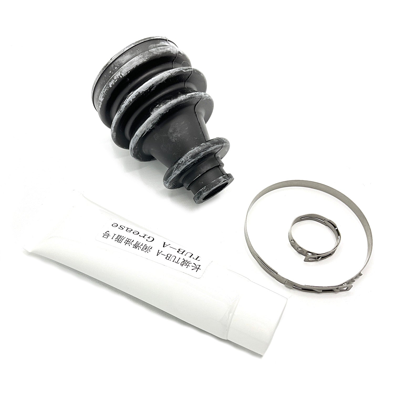 Black rubber CV boot with metal clamp and white grease tube for off-road vehicle maintenance.