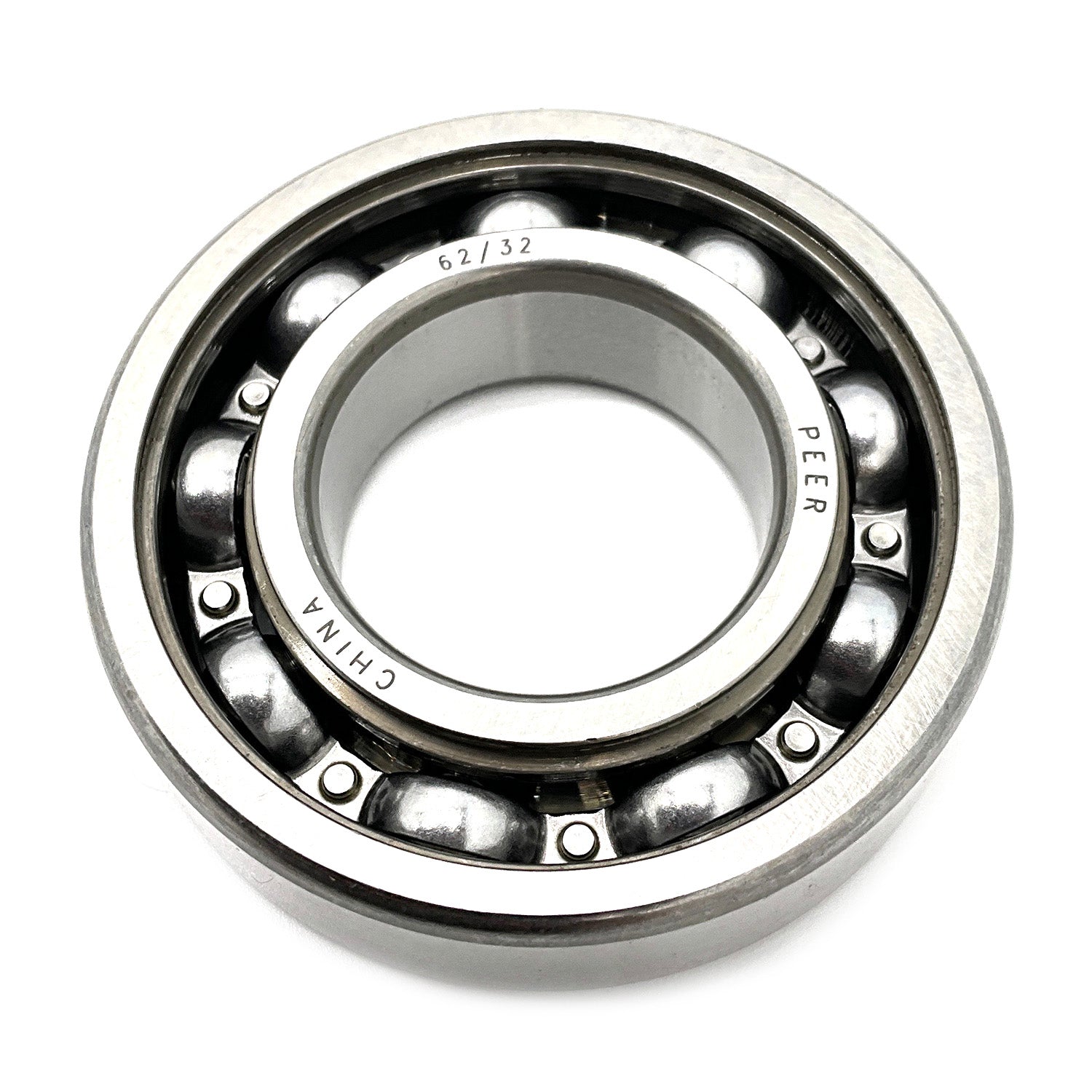 Metal ball bearing with polished steel balls and inner and outer rings, marked with manufacturing details.