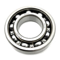 Metal ball bearing with polished steel balls and inner and outer rings, marked with manufacturing details.