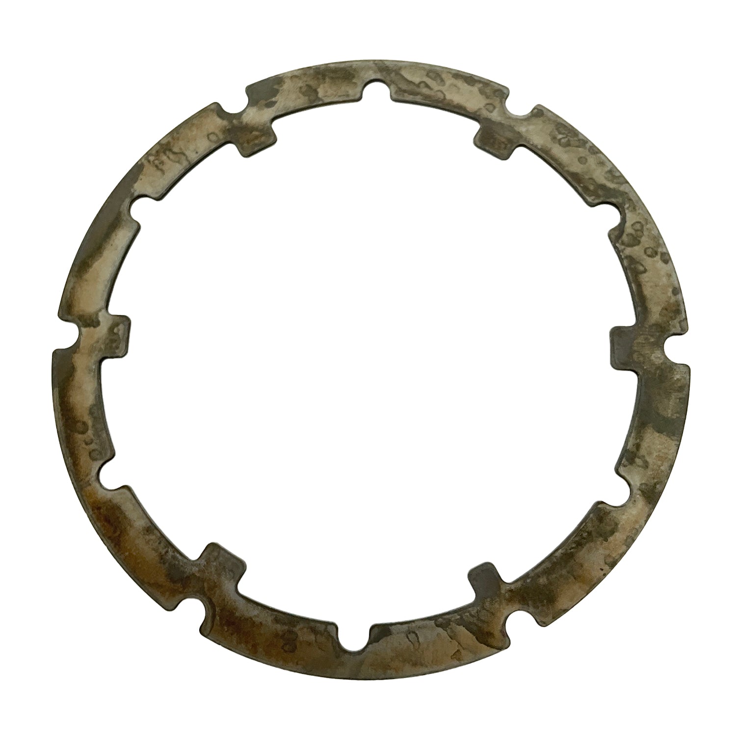 Circular metal armature plate with irregular notches and a weathered, tarnished surface.
