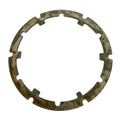 Circular metal armature plate with irregular notches and a weathered, tarnished surface.