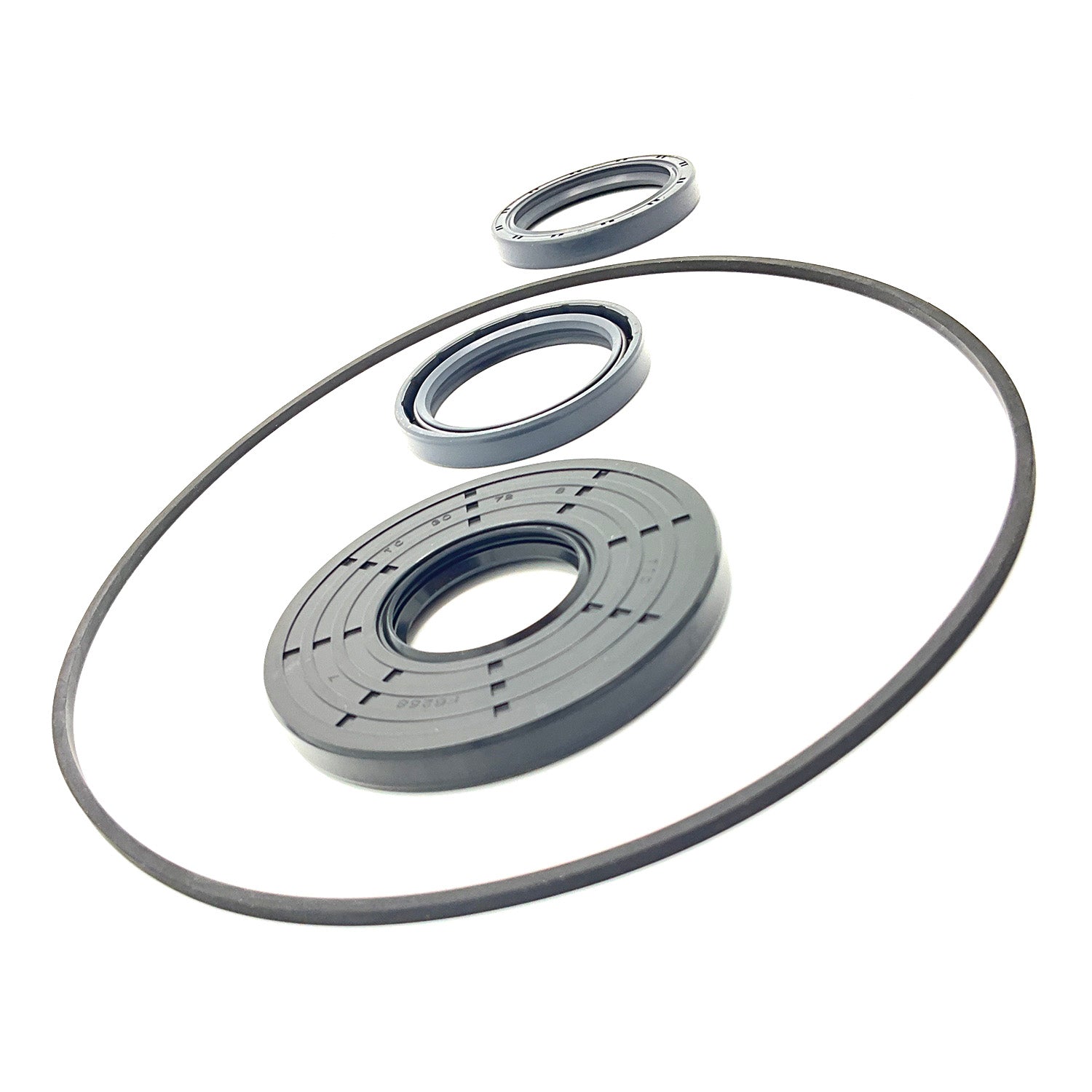 Black rubber and plastic seal repair kit components including a large circular gasket, two smaller seals, and a round.