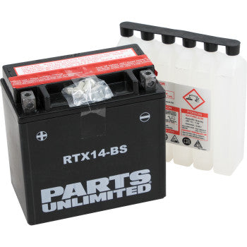 A black AGM Battery RTX14 BS .69 L by Parts Unlimited is shown beside a clear plastic acid pack with warning labels and a black cap strip.