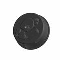 Round black speedometer with multiple small dials and connectors on the back side.