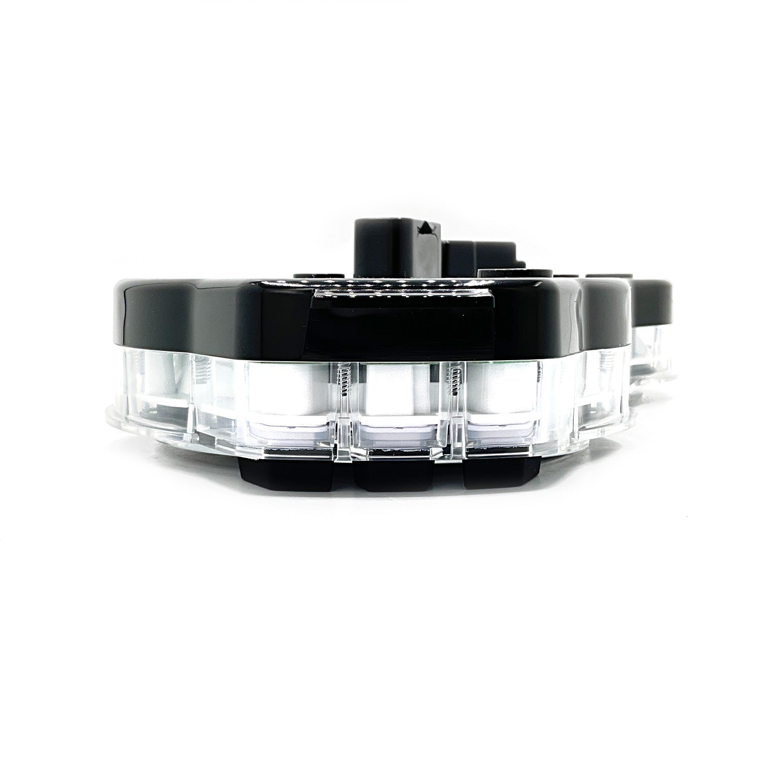 Black and clear round C4 gauge cluster housing with multiple mounting points.