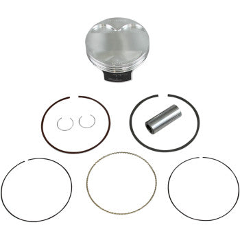 The Kawasaki Piston Kit 96.00 mm by Wiseco, shown on a white background, includes a forged piston, wrist pin, two circlips, and multiple piston rings—perfect for high-performance engine use.