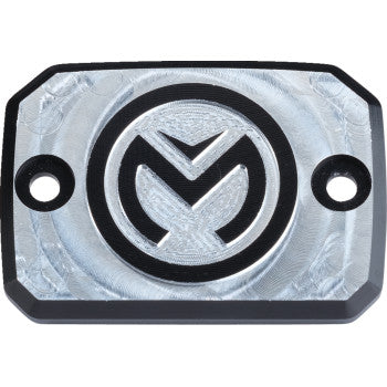 The Can Am Master Cylinder Cap by Moose Offroad is a rectangular 6061 aluminum plate with two screw holes, a circular engraved "M" logo in the center, and a brushed silver finish with black-accented edges and logo.
