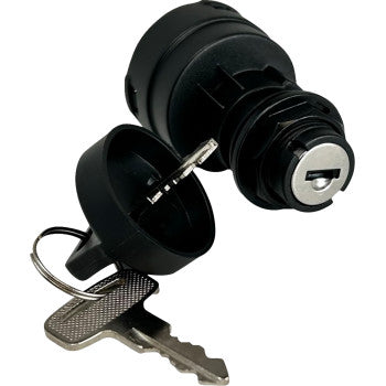 Black cylindrical ignition switch with silver key inserted, featuring a protective black cap attached by a ring.
