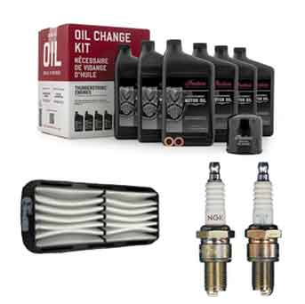 The Witchdoctors Motorcycle Maintenance Kit for Indian Challenger & Pursuit includes motor oil, an oil filter, two spark plugs, and an air filter, all displayed on a white background.