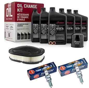 The Motorcycle Maintenance Kit for Indian Thunderstroke by Witchdoctors includes five bottles of motor oil, an oil filter, two boxed spark plugs, and an air filter—everything needed for complete maintenance.